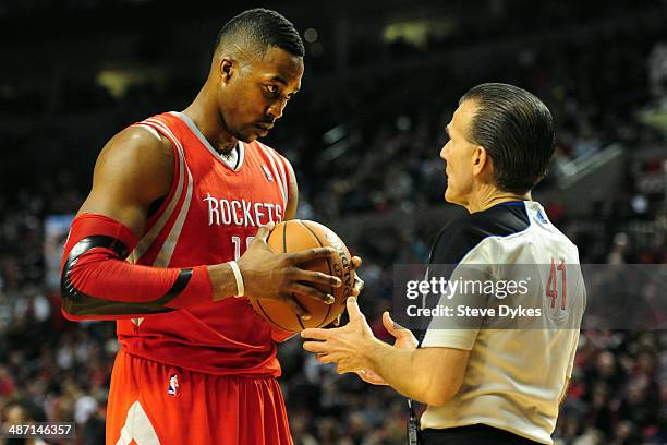 Dwight Howard of the Houston Rockets speaks with referee Ken Mauer in the second half of Game Four of the Western Conference Quarterfinals during the...