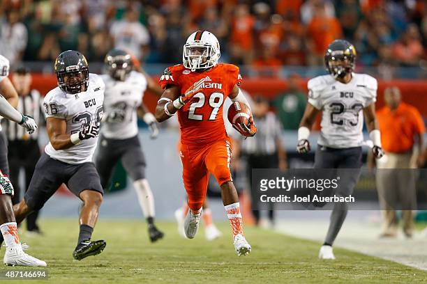 Corn Elder of the Miami Hurricanes runs with the ball against the Bethune-Cookman Wildcats on September 5, 2015 at Sun Life Stadium in Miami Gardens,...