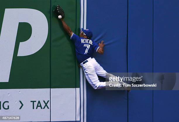 Ben Revere of the Toronto Blue Jays leaps but cannot catch an RBI double by Jimmy Paredes of the Baltimore Orioles in the sixth inning during MLB...