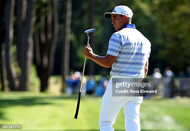 Rickie Fowler reacts after his putt on the seventh hole during round three of the Deutsche Bank Championship at TPC Boston on September 6, 2015 in...