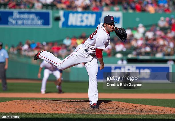 Junichi Tazawa of the Boston Red Sox pitches during the eighth inning against the Philadelphia Phillies at Fenway Park on September 6, 2015 in...
