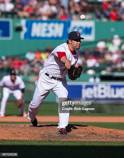 Junichi Tazawa of the Boston Red Sox pitches during the eighth inning against the Philadelphia Phillies at Fenway Park on September 6, 2015 in...