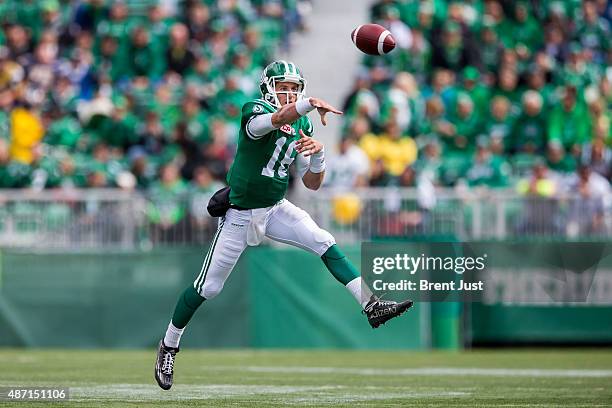 Brett Smith of the Saskatchewan Roughriders throws on the run during first half action in the game between the Winnipeg Blue Bombers and Saskatchewan...