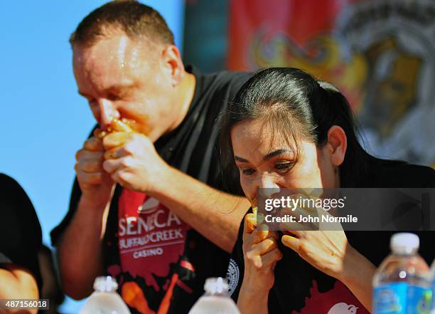 Competetive eaters Joey Chestnut and Sonya Thomas compete in the national chicken wing eating contest on September 6, 2015 in Buffalo, New York.The...