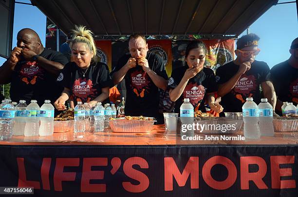 Competetive eaters Eric Badlands Booker, Miki Sudo, Joey Chestnut, Sonya Thomas, and Juan Rodriuez compete in the national chicken wing eating...