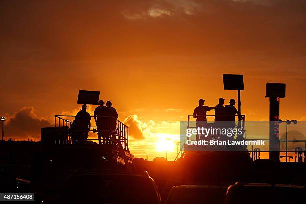 Fans watch the action from the infield during the NASCAR Sprint Cup Series Bojangles' Southern 500 at Darlington Raceway on September 6, 2015 in...