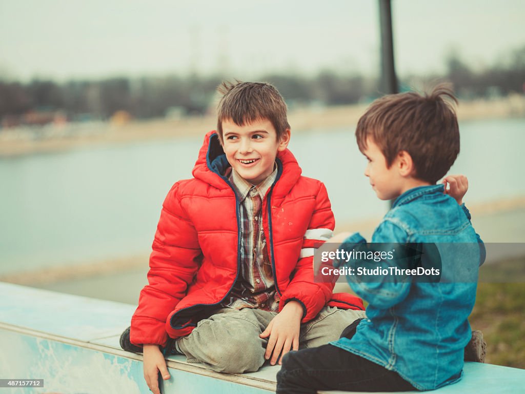 Two brothers playing outdoors