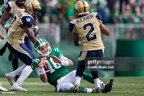 Brett Smith of the Saskatchewan Roughriders slides after a scramble in the game between the Winnipeg Blue Bombers and Saskatchewan Roughriders in...
