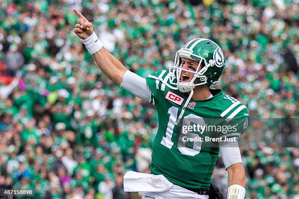 Brett Smith of the Saskatchewan Roughriders celebrates after throwing a touchdown pass in the game between the Winnipeg Blue Bombers and Saskatchewan...