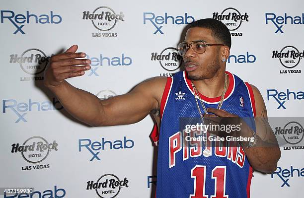 Rapper Nelly gestures to model Shantel Jackson as he attends the Hard Rock Hotel & Casino's Rehab pool party on September 6, 2015 in Las Vegas,...