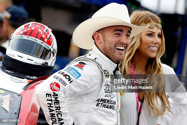 Austin Dillon, driver of the American Ethanol Chevrolet, stands on the grid with his girlfriend Taylor Walker prior to the NASCAR Sprint Cup Series...