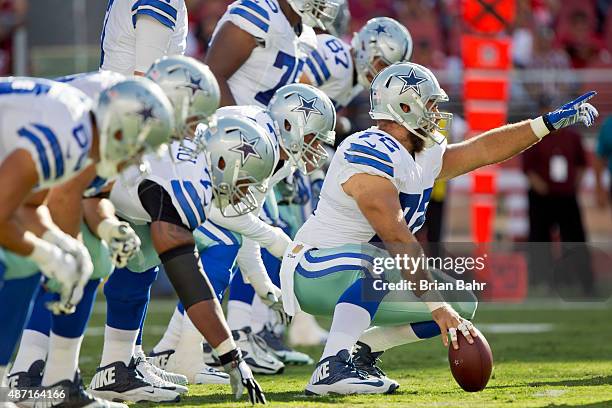 Center Travis Frederick of the Dallas Cowboys calls out the defense against the San Francisco 49ers in the first quarter during a preseason game on...