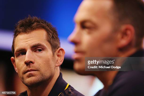 Hawthorn Hawks Captain Luke Hodge, caught drink driving last week by police, listens to Hawks head coach Alastair Clarkson speak to the media during...