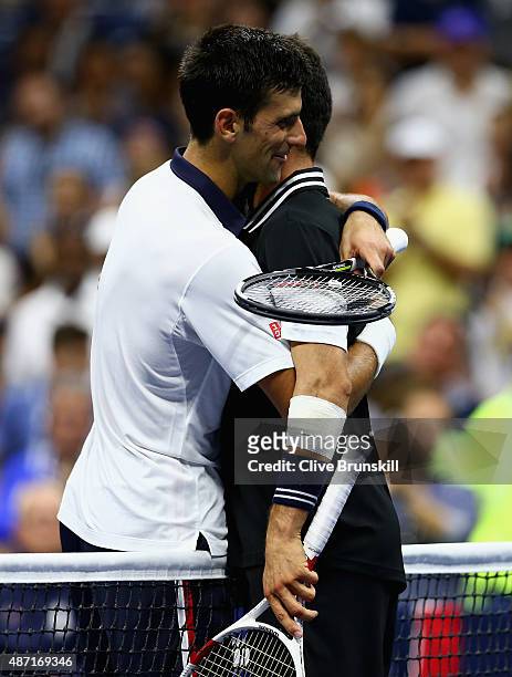 Novak Djokovic of Serbia shakes hands at the net after his four set victory against Roberto Bautista Agut of Spain in their mens singles fourth round...