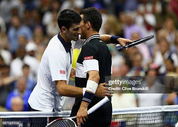 Novak Djokovic of Serbia shakes hands at the net after his four set victory against Roberto Bautista Agut of Spain in their mens singles fourth round...