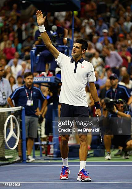 Novak Djokovic of Serbia celebrates to the crowd after his four set victory against Roberto Bautista Agut of Spain in their mens singles fourth round...