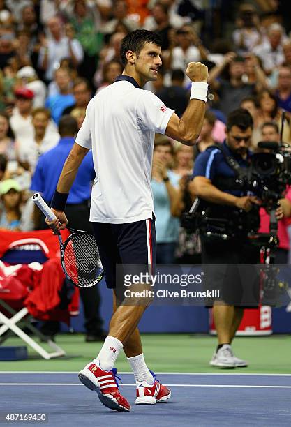 Novak Djokovic of Serbia celebrates to the crowd after his four set victory against Roberto Bautista Agut of Spain in their mens singles fourth round...
