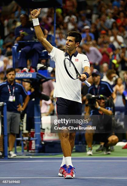 Novak Djokovic of Serbia celebrates to the crowd after his four set victory against Roberto Bautista Agut of Spain in their mens singles fourth round...