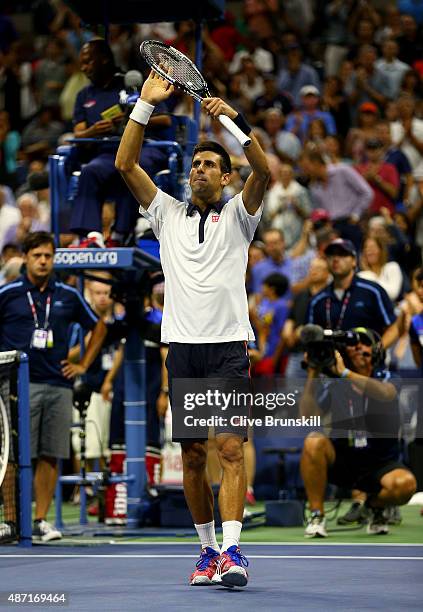 Novak Djokovic of Serbia celebrates to the crowd after his four set victory against Roberto Bautista Agut of Spain in their mens singles fourth round...