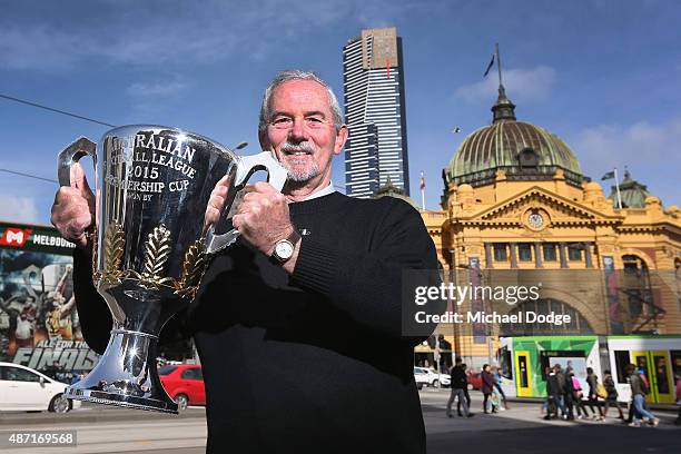 Robert Walls, former premiership coach for the Carlton Blues poses with the AFL Premiership Cup in front of the iconic Flinders Street Station during...