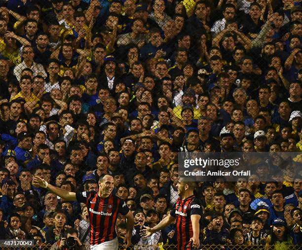 Mauro Matos of San Lorenzo celebrates with Julio Alberto Buffarini after scoring the opening goal during a match between Boca Juniors and San Lorenzo...