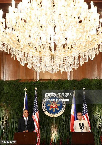 In this handout provided by Malacanang Photo Bureau', US president Barack Obama and Philippine President Benigno Aquino answers questions during a...