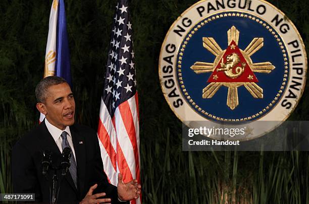 In this handout provided by Malacanang Photo Bureau', US president Barack Obama attends a joint press conference with Philippine President Benigno...