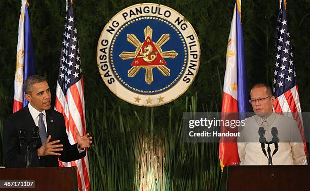 In this handout provided by Malacanang Photo Bureau', US president Barack Obama attends a joint press conference with Philippine President Benigno...