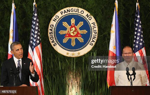 In this handout provided by Malacanang Photo Bureau', US president Barack Obama attends a joint press conference with Philippine President Benigno...