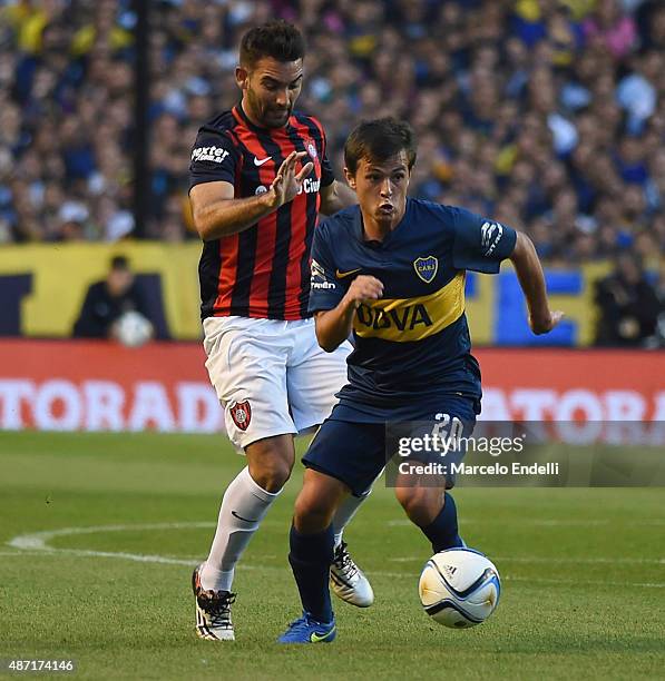 Andres Cubas of Boca Juniors is chased by Martin Cauteruccio during a match between Boca Juniors and San Lorenzo as part of 23rd round of Torneo...