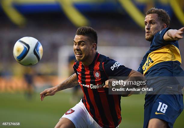 Hector Daniel Villalba of San Lorenzo and Nicolas Colazo figth for the ball during a match between Boca Juniors and San Lorenzo as part of 23rd round...