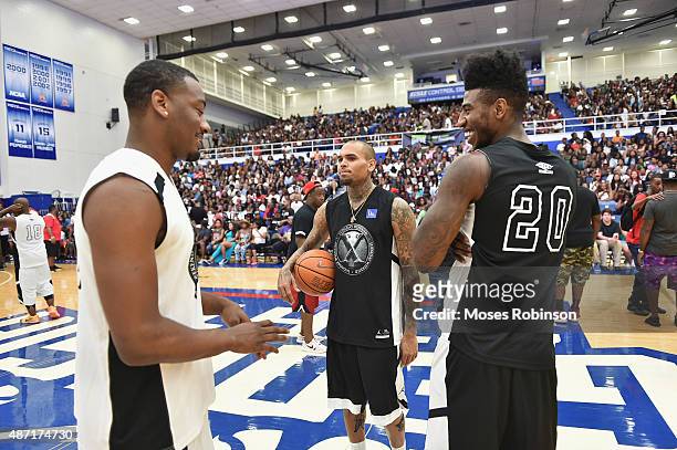Player John Wall, recording artist Chris Brown and Iman Shumpert attend LudaDay Weekend Annual Celebrity Basketball Game at Georgia State University...