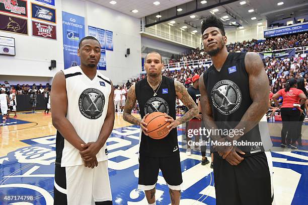 Player John Wall, recording artist Chris Brown and Iman Shumpert attend LudaDay Weekend Annual Celebrity Basketball Game at Georgia State University...