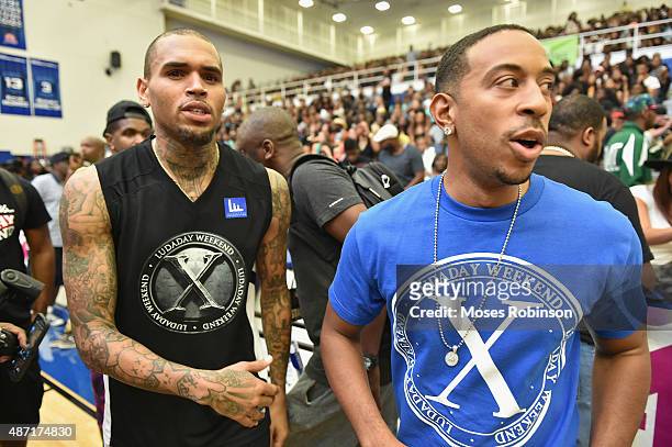 Recording artist Chris Brown and Ludacris attend LudaDay Weekend Annual Celebrity Basketball Game at Georgia State University Sports Arena on...
