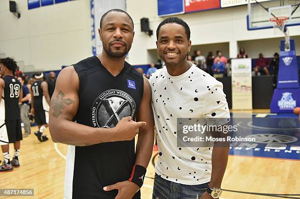 Recording artist Tank and actor Larenz Tate attend LudaDay Weekend Annual Celebrity Basketball Game at Georgia State University Sports Arena on...