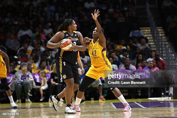 Courtney Paris of the Tulsa Shock handles the ball against Jantel Lavender of the Los Angeles Sparks in a WNBA game at Staples Center on September 6,...