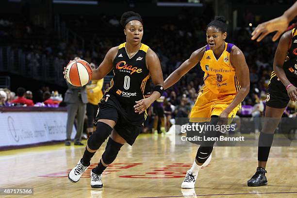 Odyssey Sims of the Tulsa Shock drives against Alana Beard of the Los Angeles Sparks in a WNBA game at Staples Center on September 6, 2015 in Los...