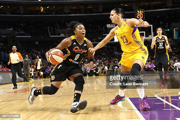 Odyssey Sims of the Tulsa Shock drives against Ana Dabovic of the Los Angeles Sparks in a WNBA game at Staples Center on September 6, 2015 in Los...