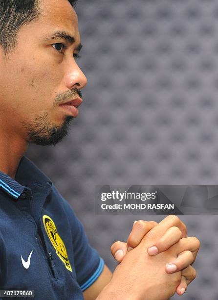Malaysia's team captain Safiq Rahim listens to questions during a press conference at the Football Association of Malaysia headquaters in Kelana...