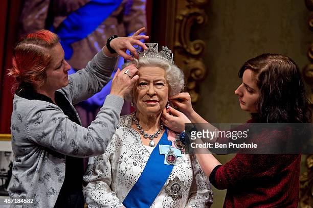 Madame Tussauds refreshes its Queen Elizabeth II wax figure with a recreation of the longest reigning monarch's diamond jubilee dress at Madame...