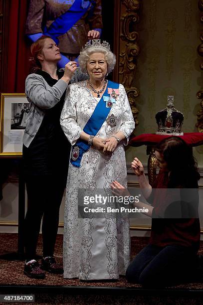 Madame Tussauds refreshes its Queen Elizabeth II wax figure with a recreation of the longest reigning monarch's diamond jubilee dress at Madame...