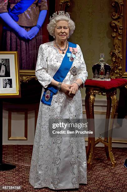 Madame Tussauds refreshes its Queen Elizabeth II wax figure with a recreation of the longest reigning monarch's diamond jubilee dress at Madame...