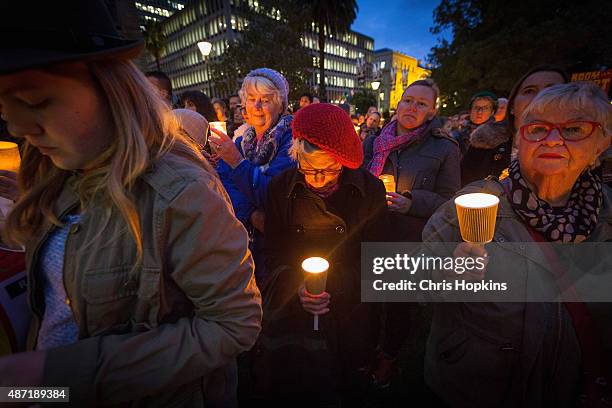 Woman takes a minutes silence in rememberence of Aylan Kurdi on September 7, 2015 in Melbourne, Australia. Thousands of people around Australia...