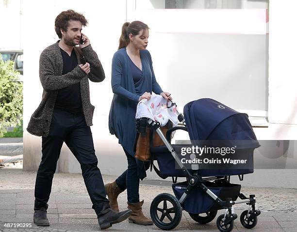 Yvonne Catterfeld sighted with her baby son Charlie, and partner Oliver Wnuk in the Prenzlauer Berg neighborhood on April 28, 2014 in Berlin, Germany.