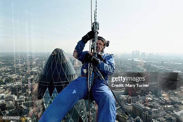 Matt Pullen from AzkoNobel abseils down the skyscraper known as the 'Cheesegrater' at 122 Leadenhall Street, during the Outward Bound Trust's and the...