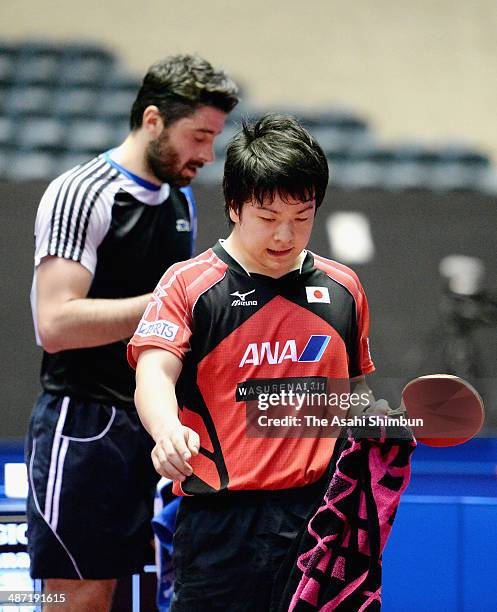 Seiya Kishikawa of Japan leaves after losing the match against Panagiotis Gionis of Greece during day one of the 2014 World Team Table Tennis...