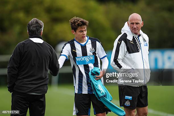 Hat trick goalscorer Lewis McNall of Newcastle is substituted and shakes hands with Academy Director Joe Joyce whilst U18 coach Dave Watson looks on...