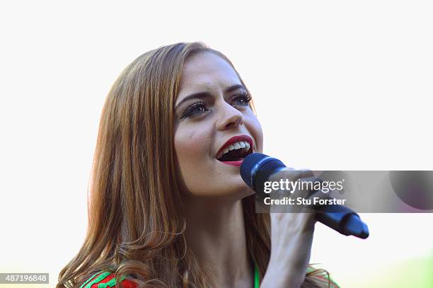 Singer Sophie Evans sings the national anthem before the UEFA EURO 2016 Qualifier between Wales and Israel at Cardiff City Stadium on September 6,...