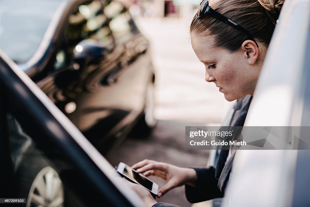 Business woman checking mails.