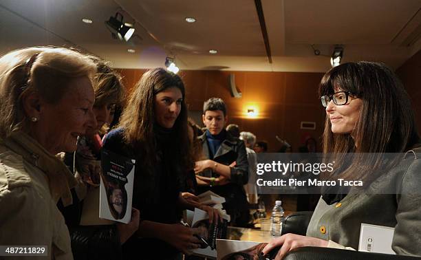 Lucia Annibali signing copies of her book 'Io ci sono - La mia storia di non amore' before its presentation at Sala Buzzati on April 28, 2014 in...